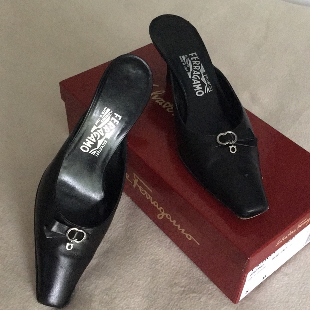 Black calfskin mules w/leather heel.